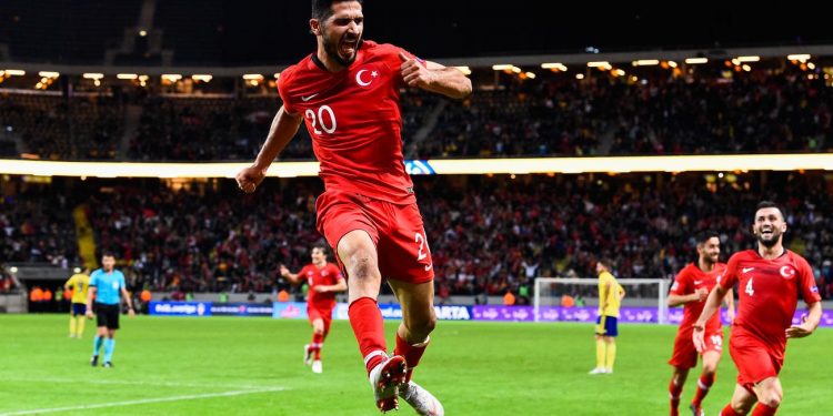 Emre Akbaba celebrates one of his two goals after scoring against Sweden