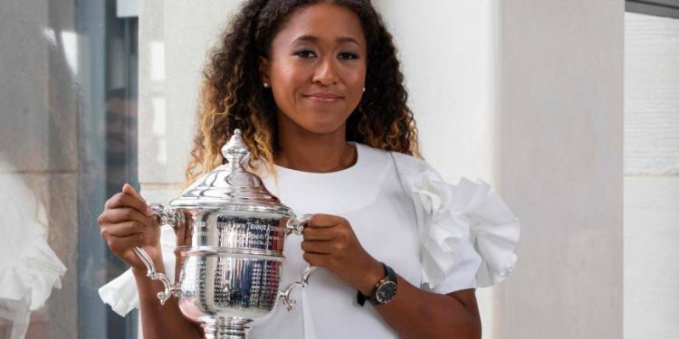 Naomi Osaka shows off the US Open women’s singles trophy Sunday at the Rockefeller Centre in New York