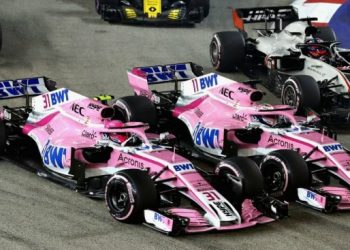 The two Force India cars collide during the Singapore Grand Prix, Sunday evening