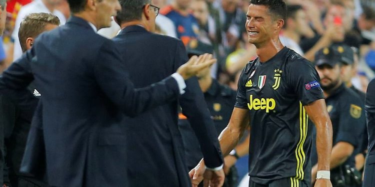A tearful Cristiano Ronaldo leaves the pitch after being red-carded in his Champions League debut for Juventus