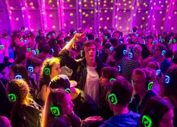 Festival goers dance at the silent disco stage during Open'er music Festival in Gdynia, Poland June 28, 2017. Picture taken June 28, 2017. REUTERS/Matej Leskovsek - RC1F38A7CBC0