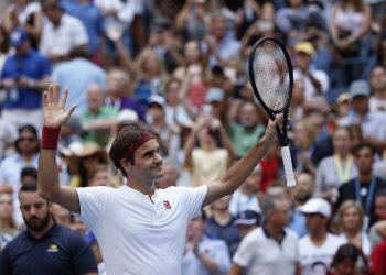 Roger Federer reacts after defeating Nick Kyrgios during the third round of the US Open tennis tournament