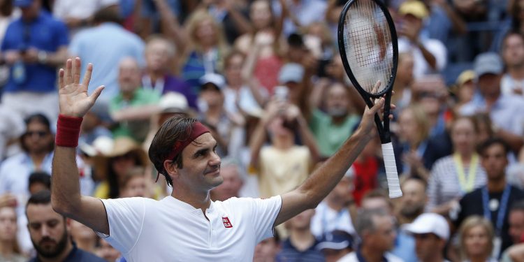 Roger Federer reacts after defeating Nick Kyrgios during the third round of the US Open tennis tournament