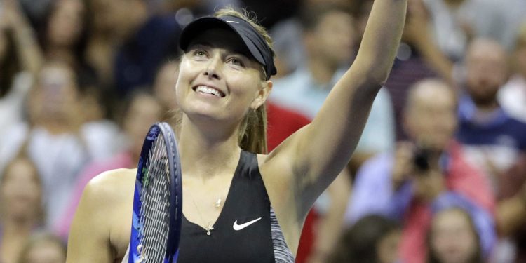 Maria Sharapova waves to the fans after defeating Jelena Ostapenko in New York, Saturday  