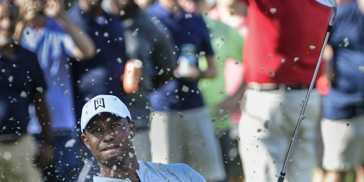 Tiger Woods hits up to the 13th green during the second round of the Tour Championship golf tournament in Atlanta, Friday   