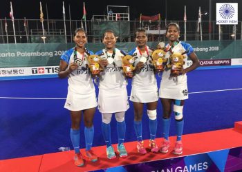 Sunita Lakra, Namita Toppo, Lilima Minz and Deep Grace Ekka pose with their silver medals at Jakarta