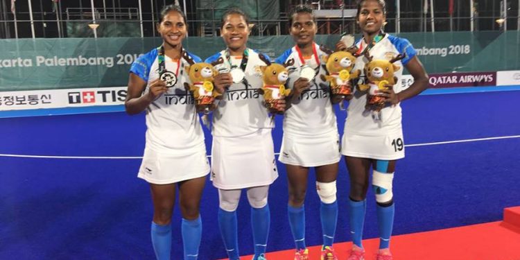 Sunita Lakra, Namita Toppo, Lilima Minz and Deep Grace Ekka pose with their silver medals at Jakarta