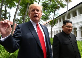 U.S. President Donald Trump gestures as he walks with North Korean leader Kim Jong Un in the Capella Hotel after their working lunch, on Sentosa island in Singapore June 12, 2018. Anthony Wallace/Pool via Reuters