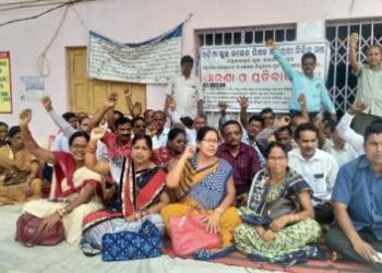 Teachers and employees of Block Grant schools stage a sit-in at Raghunathpur block near Cuttack, Wednesday