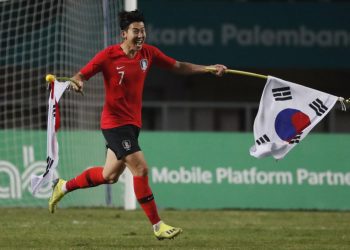 Son Heung Min of South Korea celebrates after winning the gold medal match against Japan at Asian Games