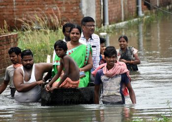 Officials visit Sujata Nagar on a boat, Tuesday OP photo