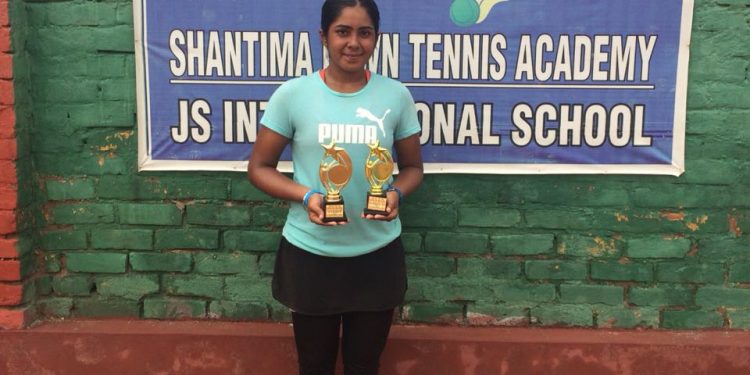 Ameek Kiran Batth poses with her trophies at Sonipat, Saturday