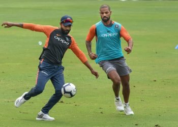 Indian cricketers Shikhar Dhawan and  Ravindra Jadeja play football during a practice session ahead of the first ODI against West Indies