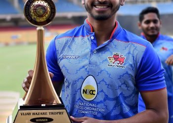 Shreyas Iyer poses with the winner's trophy