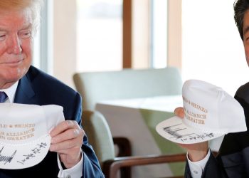 Trump and Abe with their friendship caps. Photo: Reuters