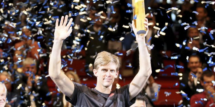 Kevin Anderson poses with the winner’s trophy in Vienna, Sunday  