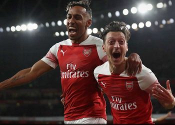 Pierre-Emerick Aubameyang (L) and Mesut Ozil celebrate Arsenal’s first goal against Leicester City, Monday 