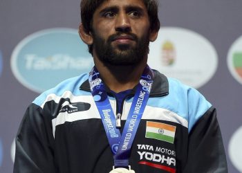 Bajrang Punia poses with his silver medal during the medal ceremony at the Wrestling World Championships in Budapest, Monday