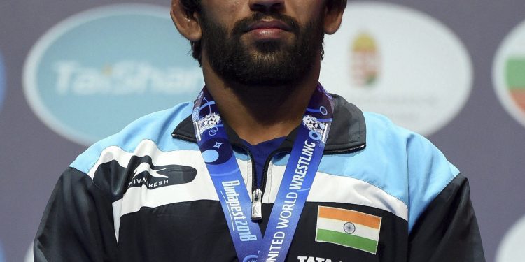 Bajrang Punia poses with his silver medal during the medal ceremony at the Wrestling World Championships in Budapest, Monday