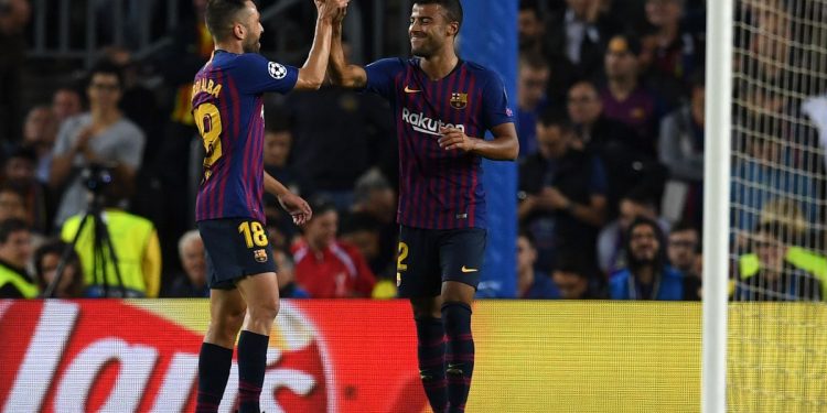 Rafinha (R) celebrates with Jordi Alba after scoring Barcelona’s opening goal against Inter, Wednesday