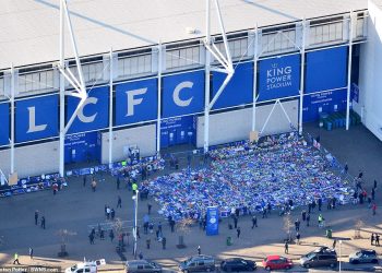 An aerial shot of the shrine created by the flowers, shirts and scarves left by supporters outside Leicester City’s King Power Stadium, Sunday