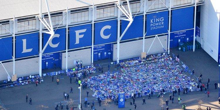 An aerial shot of the shrine created by the flowers, shirts and scarves left by supporters outside Leicester City’s King Power Stadium, Sunday