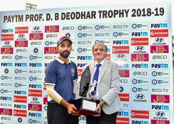 India C captain Ajinkya Rahane receives the winners’ Trophy from BCCI acting president CK Khanna in New Delhi, Saturday  