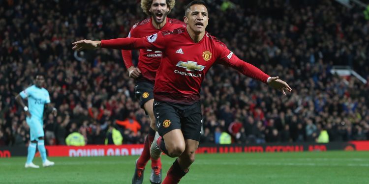 Alexis Sanchez celebrates after scoring the winner against Newcastle United at Old Trafford