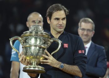 Roger Federer holds the trophy during the victory ceremony At Basel