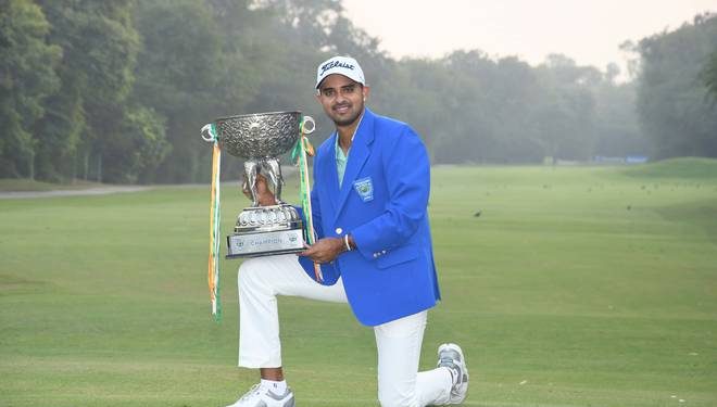 Khalin Joshi poses with the winner’s trophy at New Delhi, Sunday