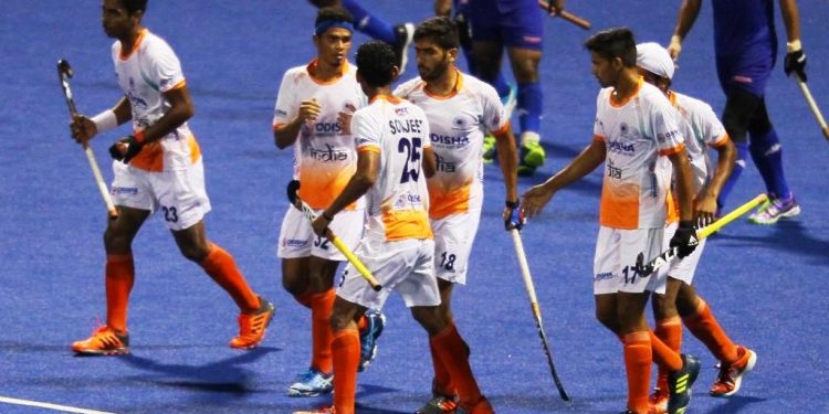 Indian players celebrate after scoring a goal against Malaysia at Johor Bahru, Saturday
