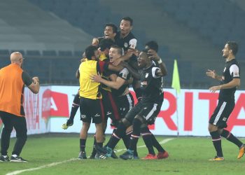 NorthEast United FC players celebrate their opening goal against Delhi Dynamos, Tuesday