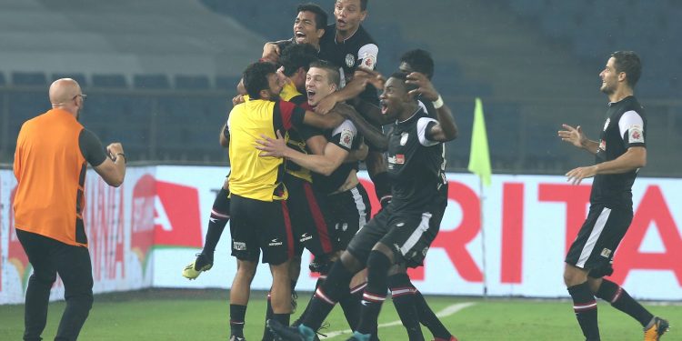 NorthEast United FC players celebrate their opening goal against Delhi Dynamos, Tuesday