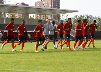 Indian players warm up during their practice session in Suzhou, Thursday