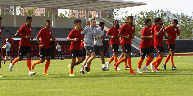 Indian players warm up during their practice session in Suzhou, Thursday