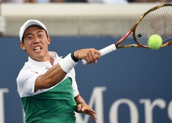 Kei Nishikori playing a shot against Yuichi Sugita in Tokyo, Monday.