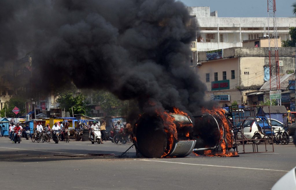 A traffic post set on fire at Market Square in Puri