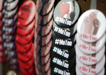 A vendor sells #MeToo badges a protest march for survivors of sexual assault and their supporters in Hollywood, Los Angeles, California U.S. November 12, 2017. REUTERS/Lucy Nicholson - RC18A2D7F850