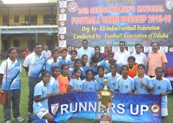 Odisha players pose with their runners-up trophy along with guests and officials at Cuttack, Monday    