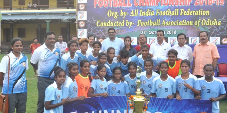 Odisha players pose with their runners-up trophy along with guests and officials at Cuttack, Monday    
