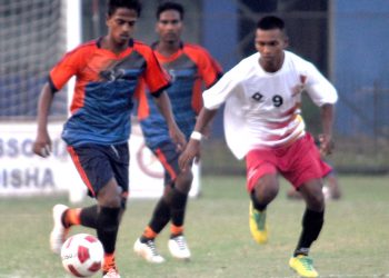 Rising Student Club and Young Utkal Club players in action during their match in Cuttack, Wednesday