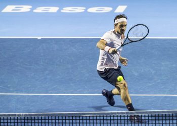 Roger Federer returns a ball to Daniil Medvedev during their semifinal match at the Swiss Indoors tennis tournament