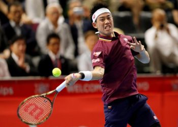 Kei Nishikori plays a shot against Richard Gasquet in Tokyo, Saturday