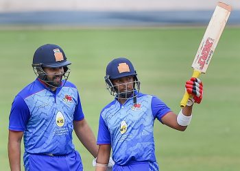 Mumbai’s Prithvi Shaw (R) raises his bat after completing half century as Rohit Sharma looks on during their match against Hyderabad in Bangalore, Wednesday 