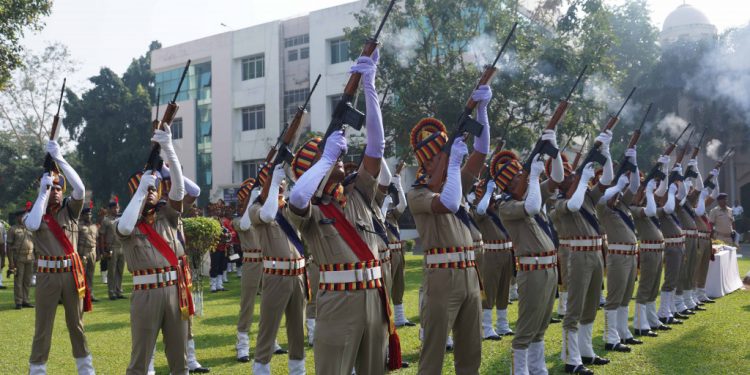 Police personnel pay gun salutes to martyrs during the celebration of 59th state-level Police Commemoration Day in Cuttack, Sunday