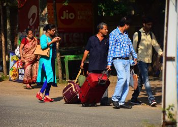 Tourists walk to reach their destinations