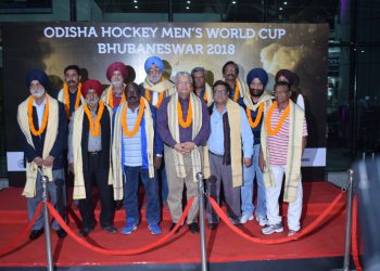 The members of the 1975 World Cup-winning Indian hockey team pose for a photograph on their arrival at the Biju Patnaik International Airport, Monday    