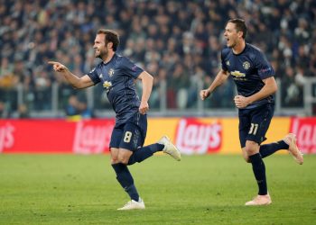 Juan Mata wheels away in celebration after scoring the equaliser as Nemanja Matic runs to join in against Juventus at Turin, Wednesday