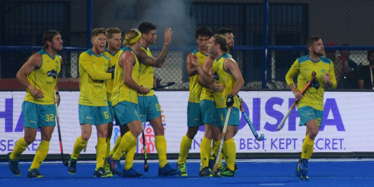 Australia players celebrate after scoring against Ireland, Friday
