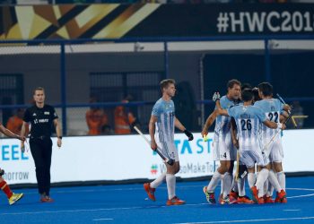 Argentina players celebrate after scoring again Spain at the Kalinga Stadium, Thursday